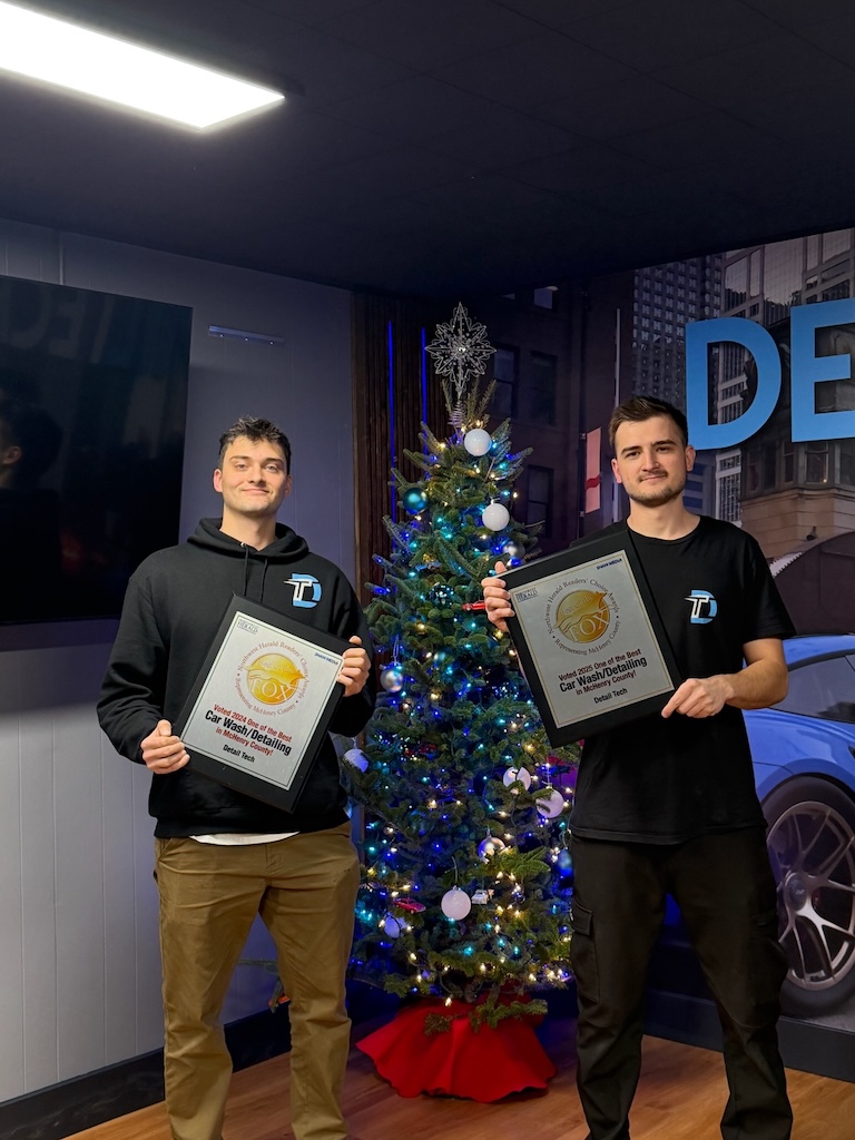 Detail Tech owners holding the 2024 and 2025 Best of the Fox awards for Car Wash and Detailing