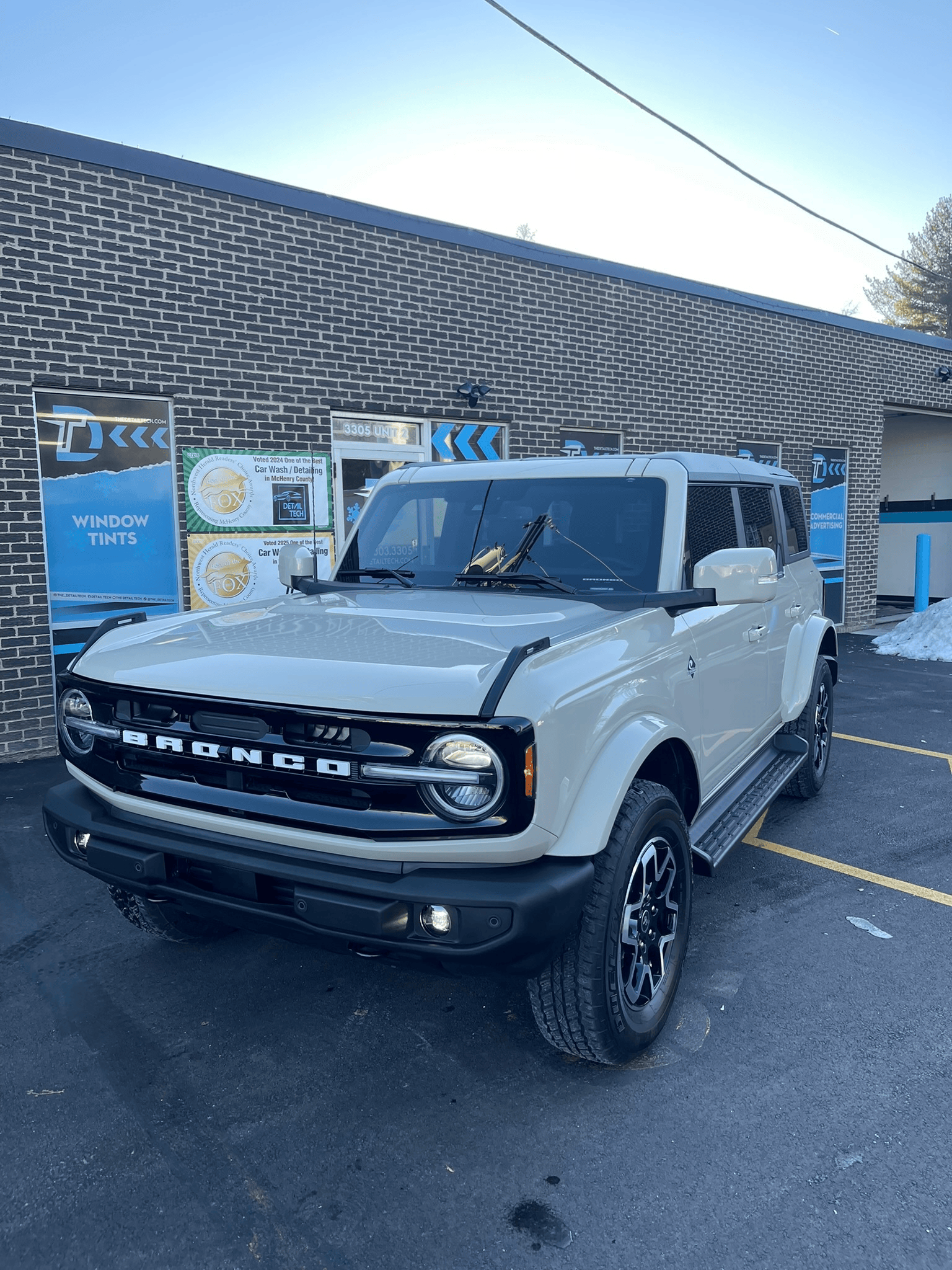 Cream Ford Bronco detailed outside the Detail Tech shop