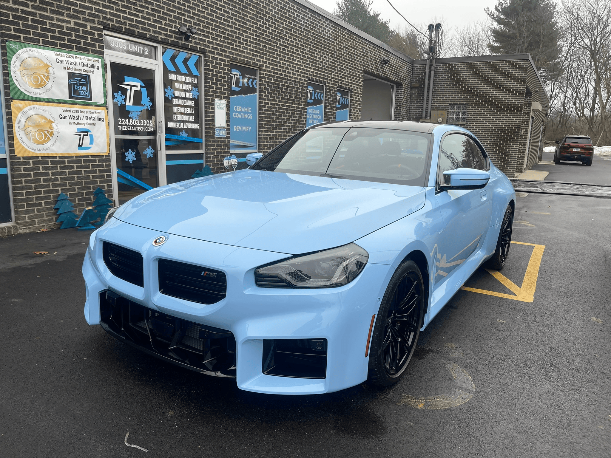 Light blue BMW M2 after a Premium interior and exterior detail outside the Detail Tech shop