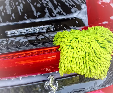 Safe hand wash on a Ferrari during an exterior detail at Detail Tech
