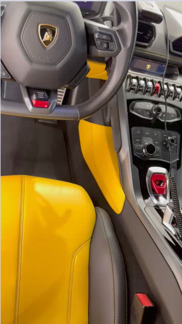 Yellow leather seat and console of a Lamborghini Huracan after a Level 1 interior detail