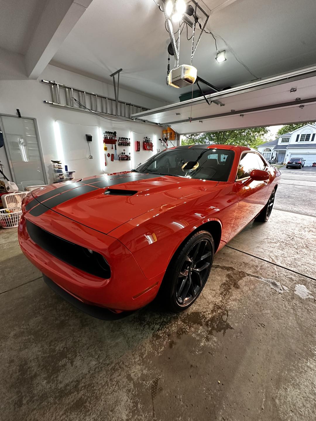 Detailed red Dodge Challenger in the garage