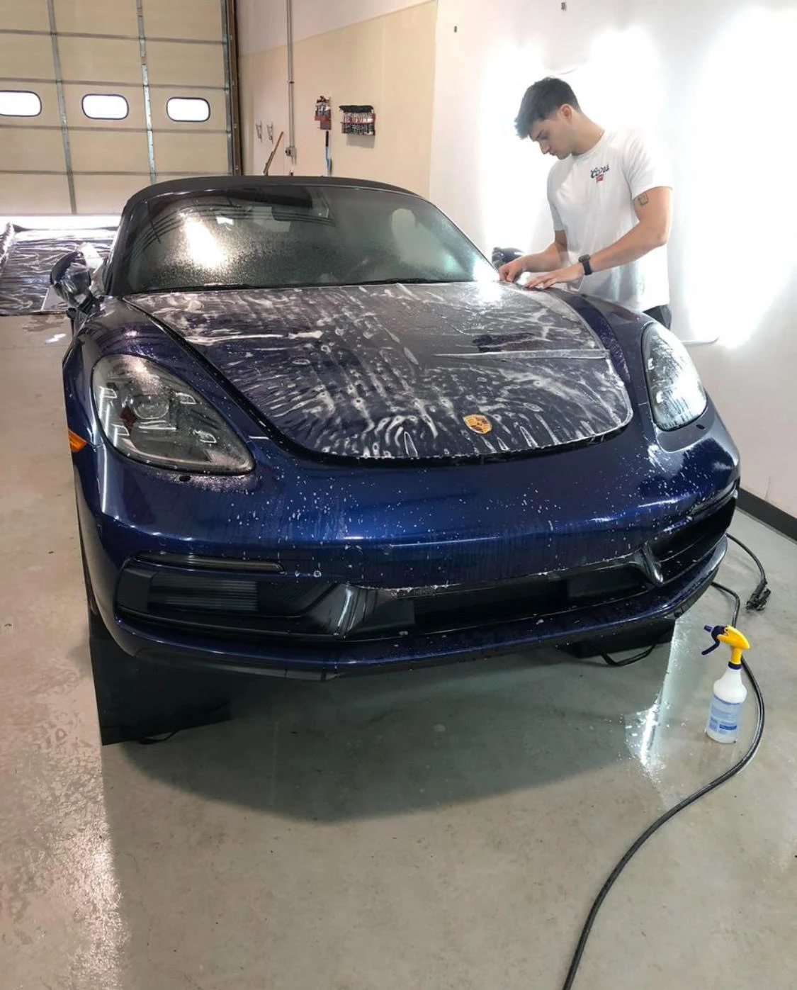 Paint protection film being applied to a vehicle panel