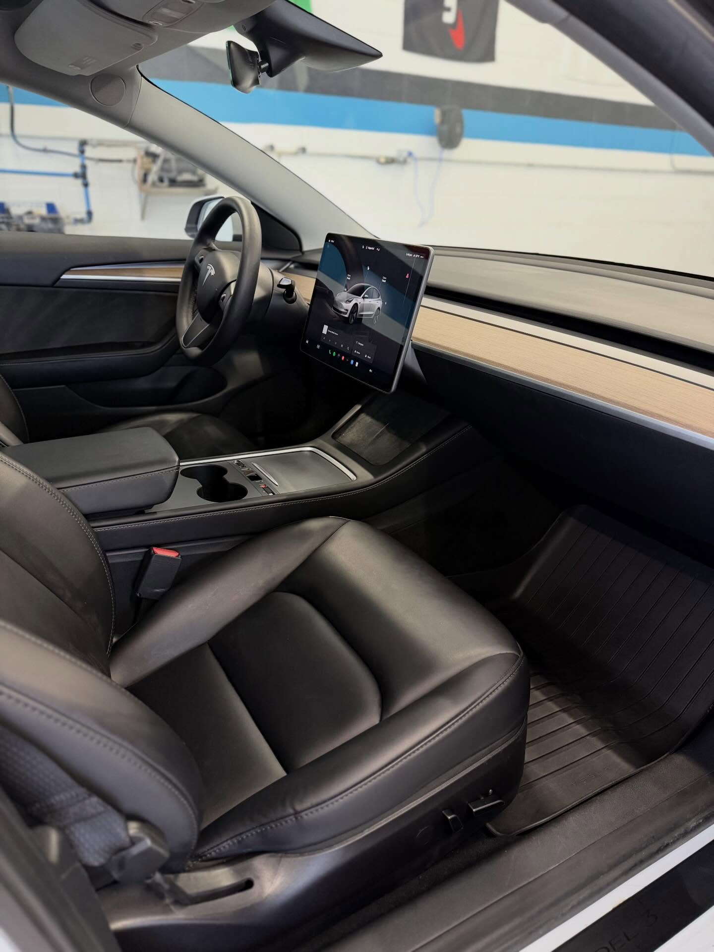 Tesla cabin and tinted windows at Detail Tech