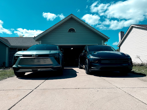 Two EVs protected with PPF and ceramic in the driveway
