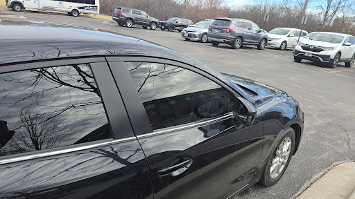 Black sedan with tinted windows at Detail Tech