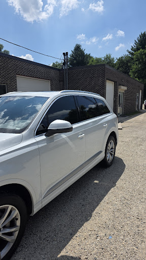 White Audi Q7 with tinted windows at Detail Tech