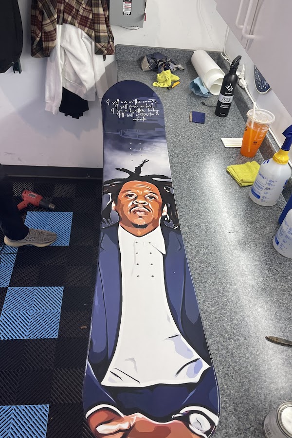 Custom vinyl-wrapped snowboard art at Detail Tech