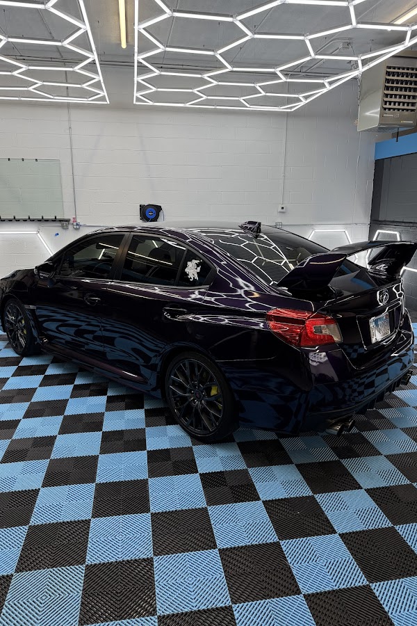 Color-shift wrapped Subaru WRX, rear quarter, at Detail Tech